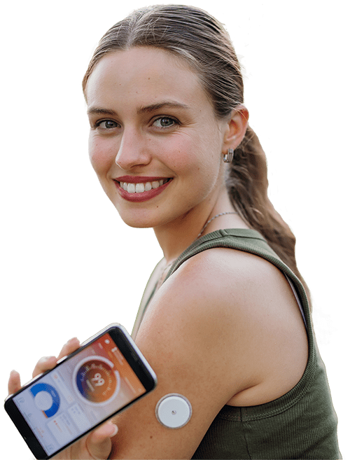 Smiling young woman with Continuous Glucose Monitor.